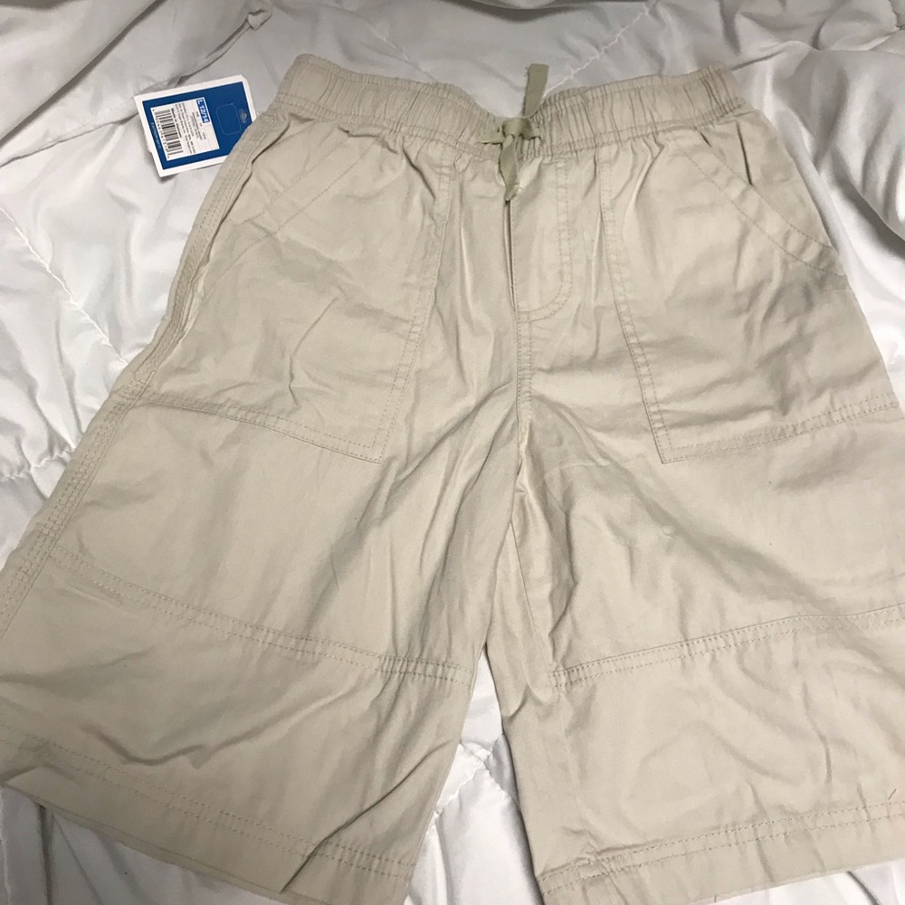Boys NWT Beige uniform shorts. Size L. Never worn.